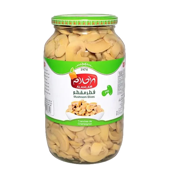 A glass jar of Al Alam Mushroom Slices filled with sliced mushrooms, featuring a green and white label with the Al Alam brand logo, set against a solid black background.